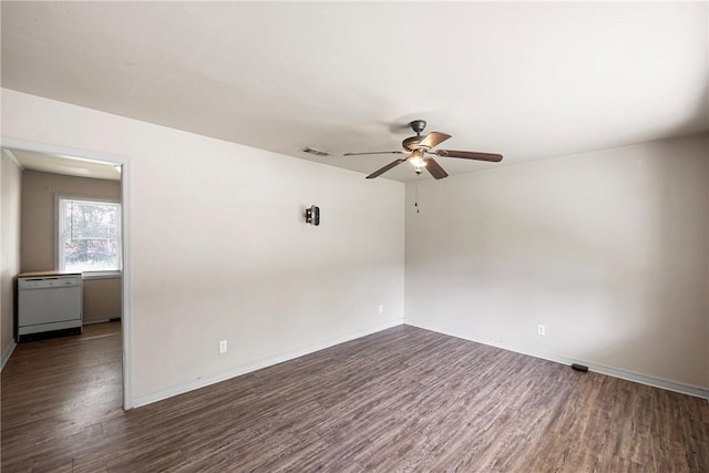 806 W 3rd St, Russellville, AR 72801 - empty room featuring ceiling fan, dark wood finished floors, and baseboards