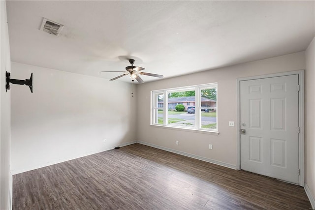 806 W 3rd St, Russellville, AR 72801 - unfurnished room with wood finished floors, ceiling fan, and baseboards