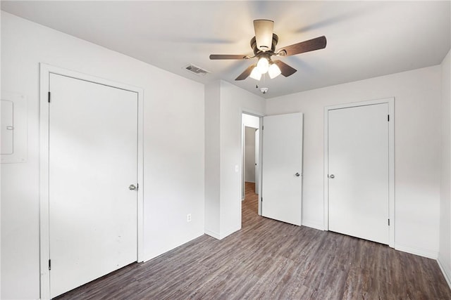 806 W 3rd St, Russellville, AR 72801 - unfurnished bedroom with wood finished floors, baseboards, and ceiling fan