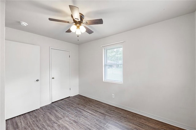 806 W 3rd St, Russellville, AR 72801 - unfurnished bedroom featuring wood finished floors, baseboards, and ceiling fan