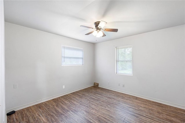 806 W 3rd St, Russellville, AR 72801 - empty room featuring plenty of natural light, ceiling fan, wood finished floors, and baseboards
