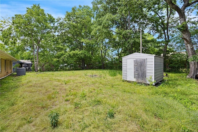 806 W 3rd St, Russellville, AR 72801 - view of yard featuring a shed, an outdoor structure, and central AC unit