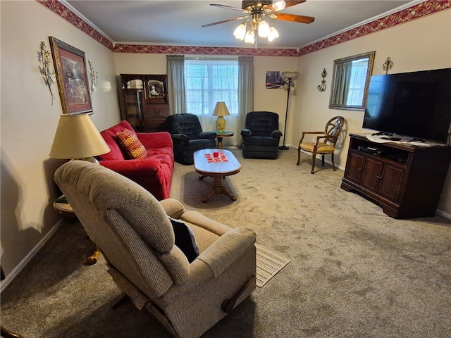 living area featuring a ceiling fan, light colored carpet, crown molding, and baseboards