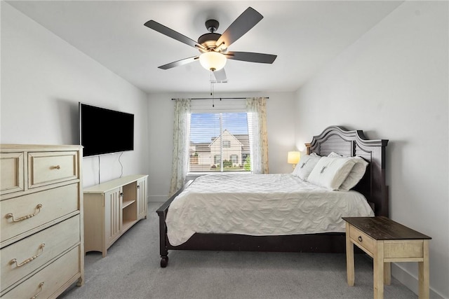 bedroom with light carpet and ceiling fan