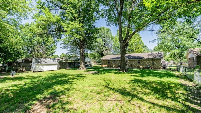 view of yard with a shed and an outdoor structure