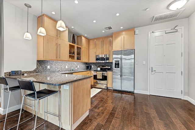 401 W Watson St Unit 408, Fayetteville, AR 72701 - kitchen with stainless steel appliances, light brown cabinets, dark wood-type flooring, a peninsula, and recessed lighting