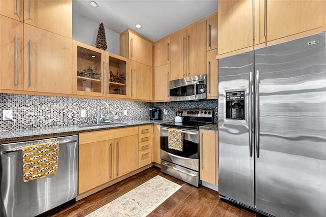 401 W Watson St Unit 408, Fayetteville, AR 72701 - kitchen with appliances with stainless steel finishes, dark stone counters, a sink, recessed lighting, and glass insert cabinets