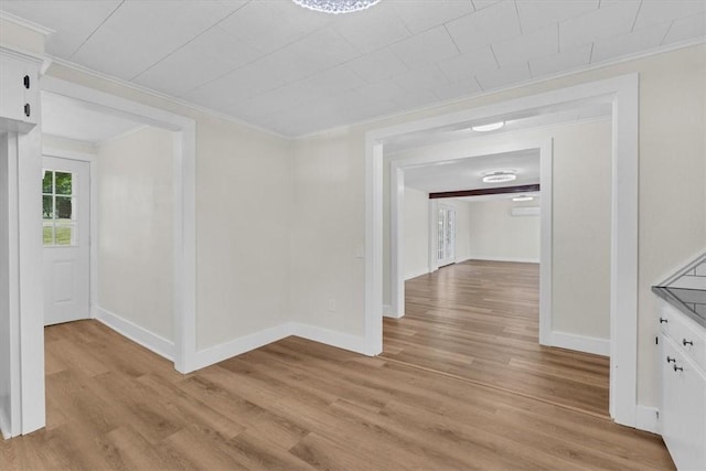 21106 Kirksey Rd, Elkins, AR 72727 - corridor featuring crown molding, light wood finished floors, and baseboards
