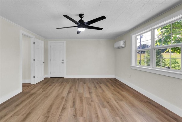 21106 Kirksey Rd, Elkins, AR 72727 - empty room featuring healthy amount of natural light, wood finished floors, a wall mounted air conditioner, ceiling fan, and ornamental molding