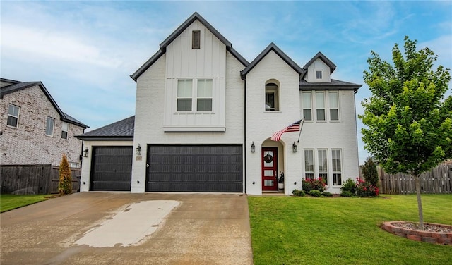 view of front of house with board and batten siding, concrete driveway, an attached garage, and brick siding