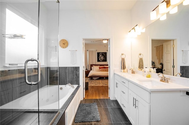 bathroom with connected bathroom, a shower with door, a bath, and double vanity