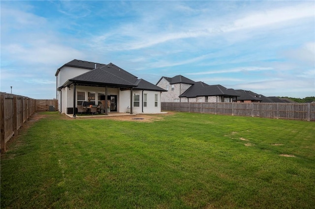 rear view of house with a patio