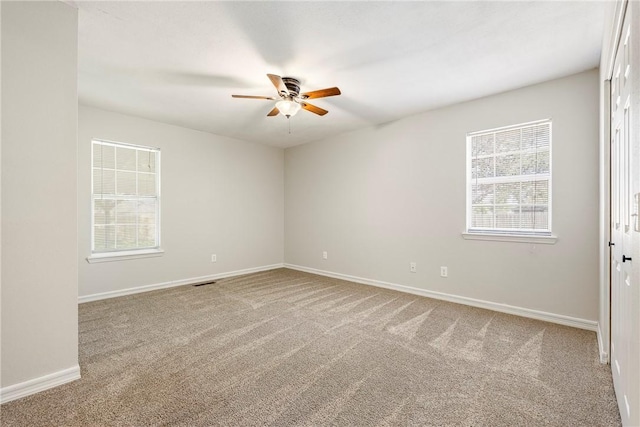 655 Bloomfield St, Gentry, AR 72734 - empty room with a ceiling fan, healthy amount of natural light, carpet floors, and baseboards