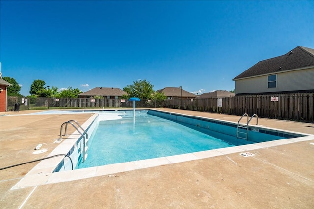 community pool featuring fence