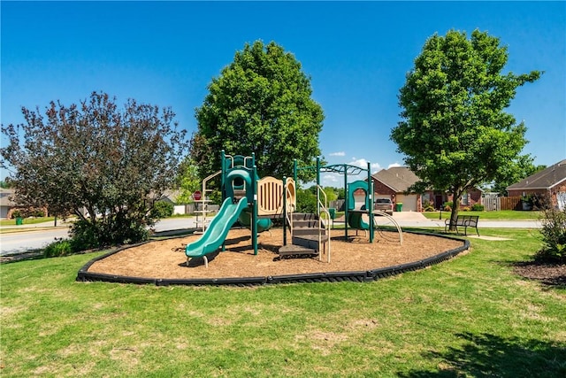 community play area featuring a lawn