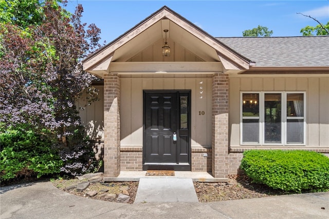 10 Forfar Cir, Bella Vista, AR 72715 - property entrance with brick siding and roof with shingles