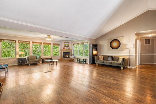 10 Forfar Cir, Bella Vista, AR 72715 - living area with a fireplace, baseboards, plenty of natural light, crown molding, and wood finished floors