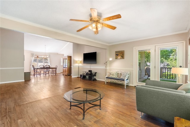 10 Forfar Cir, Bella Vista, AR 72715 - living room featuring wood finished floors, ceiling fan, ornamental molding, baseboards, and a chandelier