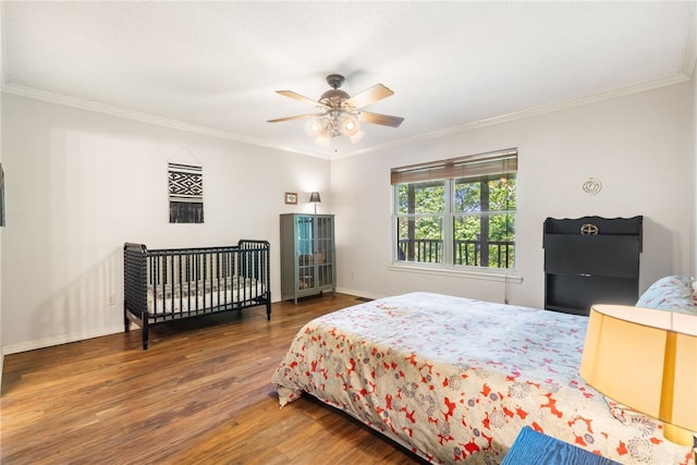 10 Forfar Cir, Bella Vista, AR 72715 - bedroom featuring wood finished floors, ornamental molding, baseboards, and ceiling fan