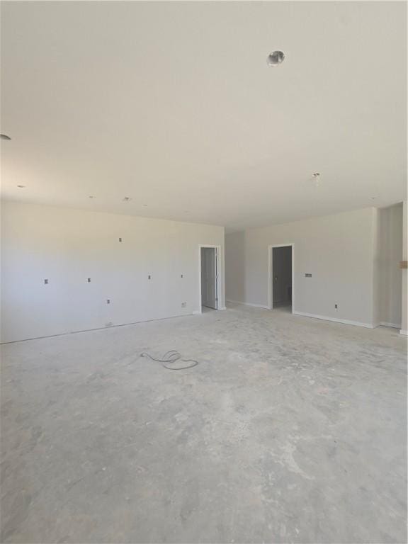 2308 Lexington St, Siloam Springs, AR 72761 - spare room featuring unfinished concrete floors and baseboards
