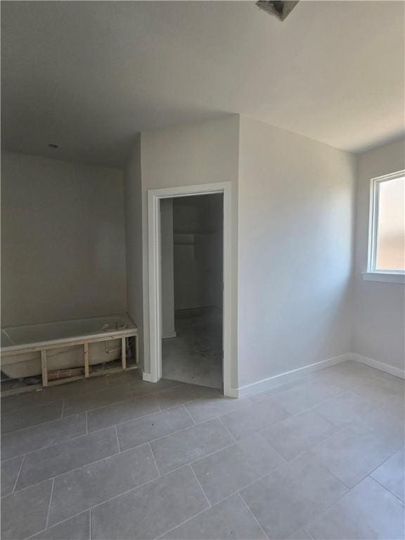2308 Lexington St, Siloam Springs, AR 72761 - tiled spare room featuring baseboards
