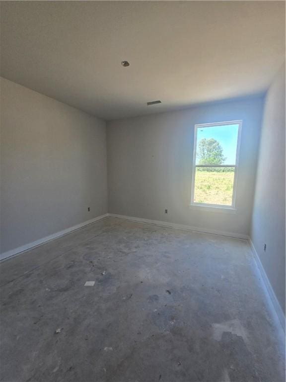2308 Lexington St, Siloam Springs, AR 72761 - empty room featuring unfinished concrete floors and baseboards