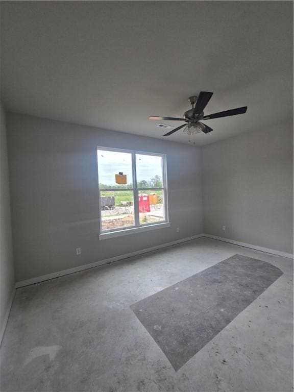 2308 Lexington St, Siloam Springs, AR 72761 - spare room with unfinished concrete flooring and ceiling fan