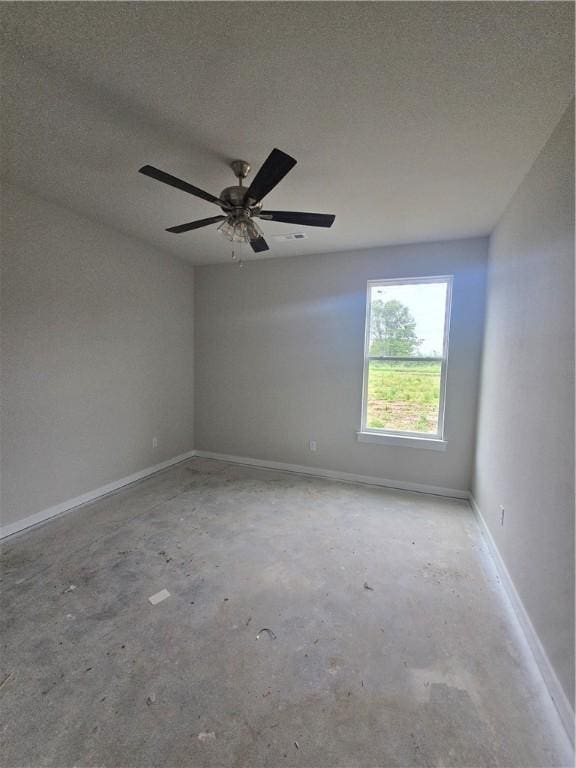 2308 Lexington St, Siloam Springs, AR 72761 - empty room featuring unfinished concrete floors and a textured ceiling