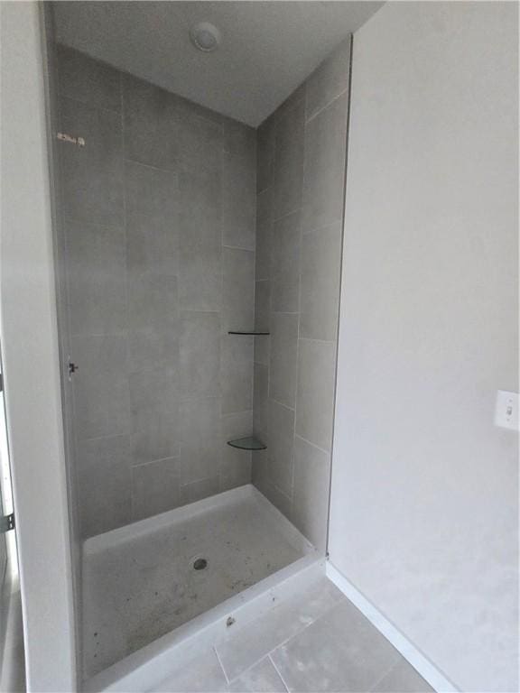 2308 Lexington St, Siloam Springs, AR 72761 - bathroom with tile patterned flooring and a tile shower