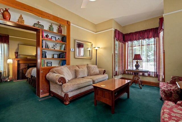 35 Kingshighway, Eureka Springs, AR 72632 - carpeted living room with a fireplace and ceiling fan