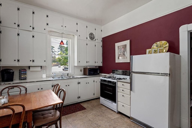 35 Kingshighway, Eureka Springs, AR 72632 - kitchen featuring white appliances, a sink, white cabinetry, light countertops, and light tile patterned floors