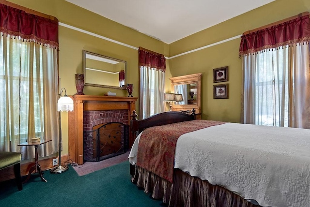 35 Kingshighway, Eureka Springs, AR 72632 - bedroom with multiple windows, carpet floors, and a brick fireplace
