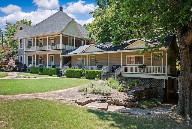 35 Kingshighway, Eureka Springs, AR 72632 - view of front of home with a porch, a front yard, and a balcony