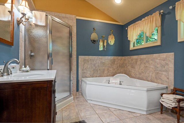 35 Kingshighway, Eureka Springs, AR 72632 - bathroom featuring vaulted ceiling, a stall shower, a bath, tile patterned floors, and vanity