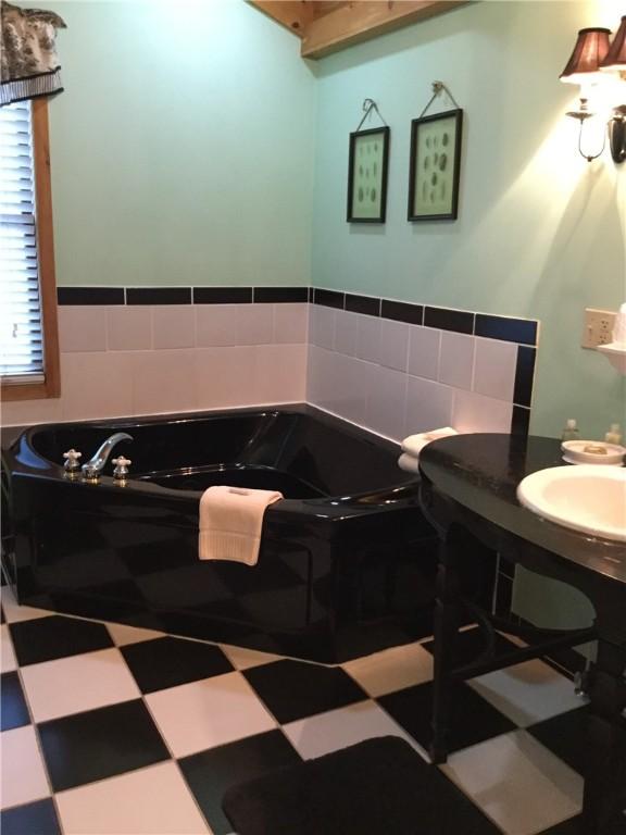 35 Kingshighway, Eureka Springs, AR 72632 - full bathroom featuring a garden tub and tile patterned floors