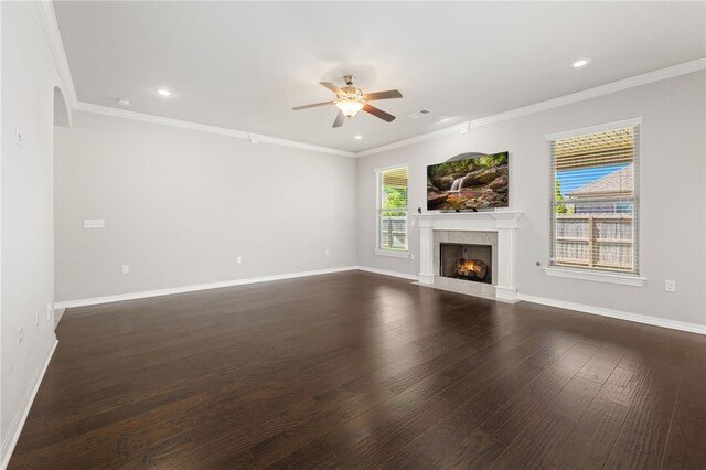4471 W Oldham Dr, Fayetteville, AR 72704 - unfurnished living room featuring ceiling fan, a warm lit fireplace, dark wood-type flooring, recessed lighting, and baseboards