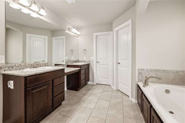 4471 W Oldham Dr, Fayetteville, AR 72704 - full bath with two vanities, a bath, and tile patterned flooring
