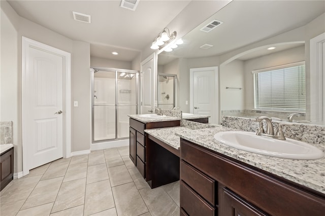 4471 W Oldham Dr, Fayetteville, AR 72704 - bathroom featuring a stall shower, two vanities, tile patterned floors, baseboards, and recessed lighting