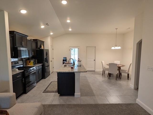 508 NW 62nd Ave, Bentonville, AR 72713 - kitchen featuring black appliances, a sink, lofted ceiling, light stone countertops, and a chandelier