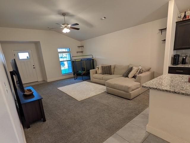 508 NW 62nd Ave, Bentonville, AR 72713 - living area with vaulted ceiling, ceiling fan, baseboards, light carpet, and light tile patterned floors