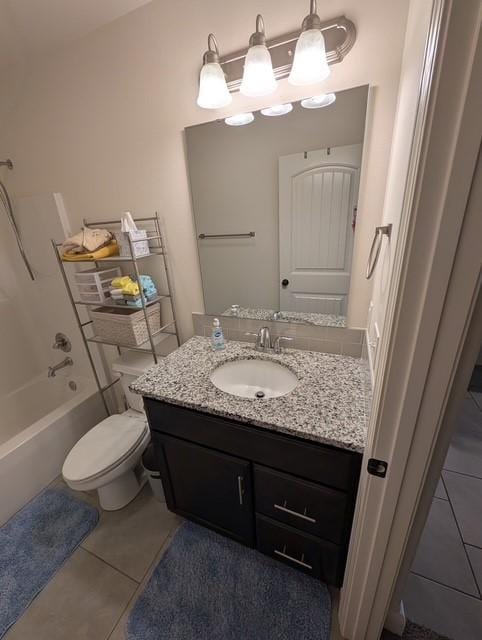 508 NW 62nd Ave, Bentonville, AR 72713 - full bathroom with vanity, tile patterned flooring, toilet, and washtub / shower combination