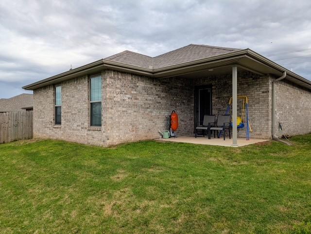 508 NW 62nd Ave, Bentonville, AR 72713 - rear view of property with a patio area and brick siding