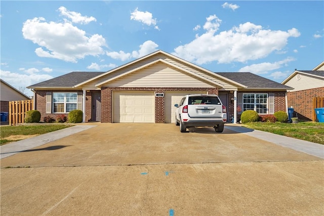 ranch-style house featuring brick siding, a garage, driveway, and fence
