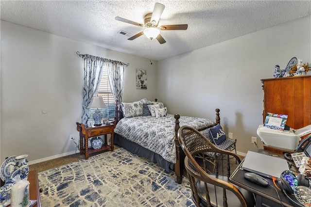 carpeted bedroom with baseboards, a textured ceiling, and a ceiling fan