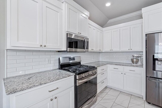 2204 N Kathryn Ln, Siloam Springs, AR 72761 - kitchen featuring appliances with stainless steel finishes, light marble finish floors, white cabinetry, light stone countertops, and crown molding