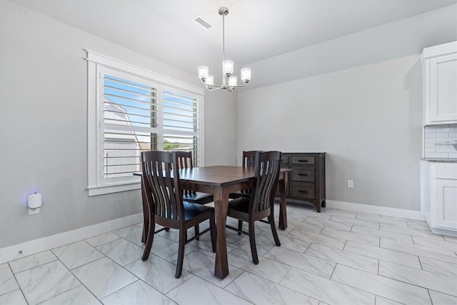 2204 N Kathryn Ln, Siloam Springs, AR 72761 - dining room featuring a chandelier, baseboards, and light marble finish floors