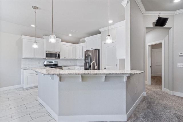 2204 N Kathryn Ln, Siloam Springs, AR 72761 - kitchen featuring appliances with stainless steel finishes, a kitchen bar, white cabinetry, light stone countertops, and backsplash