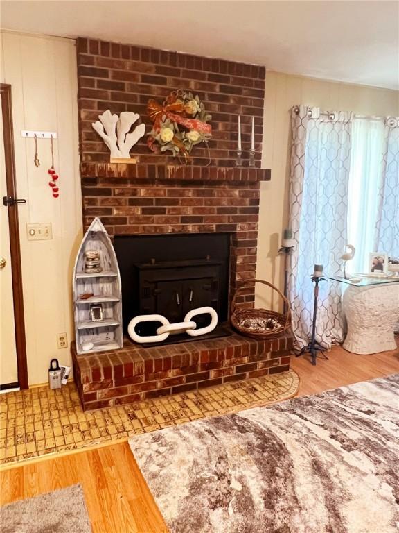 134 E Sherwood Dr, Lead Hill, AR 72644 - detailed view of wood finished floors and a fireplace