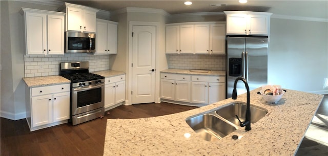 3279 Summer View Ave, Springdale, AR 72764 - kitchen featuring appliances with stainless steel finishes, a sink, dark wood-type flooring, white cabinetry, and recessed lighting