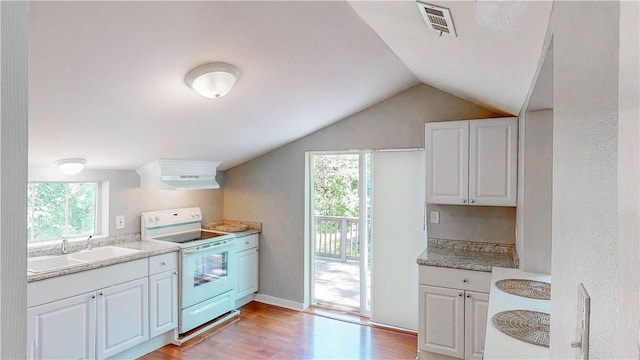 1230 W Mount Comfort Rd, Fayetteville, AR 72703 - kitchen with electric stove, a sink, healthy amount of natural light, white cabinets, and lofted ceiling